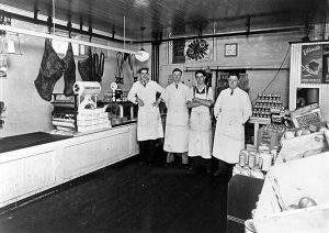 Interior of Clappison Bros Butcher Shop in 1931-32. Left to Right is Ernie Zeron, John Clappison, Jack Reid, and William Clappison.