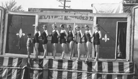 Adella and the Diving Venuses, circa 1919, lined up in front of their diving tank on stage in the Seattle area.